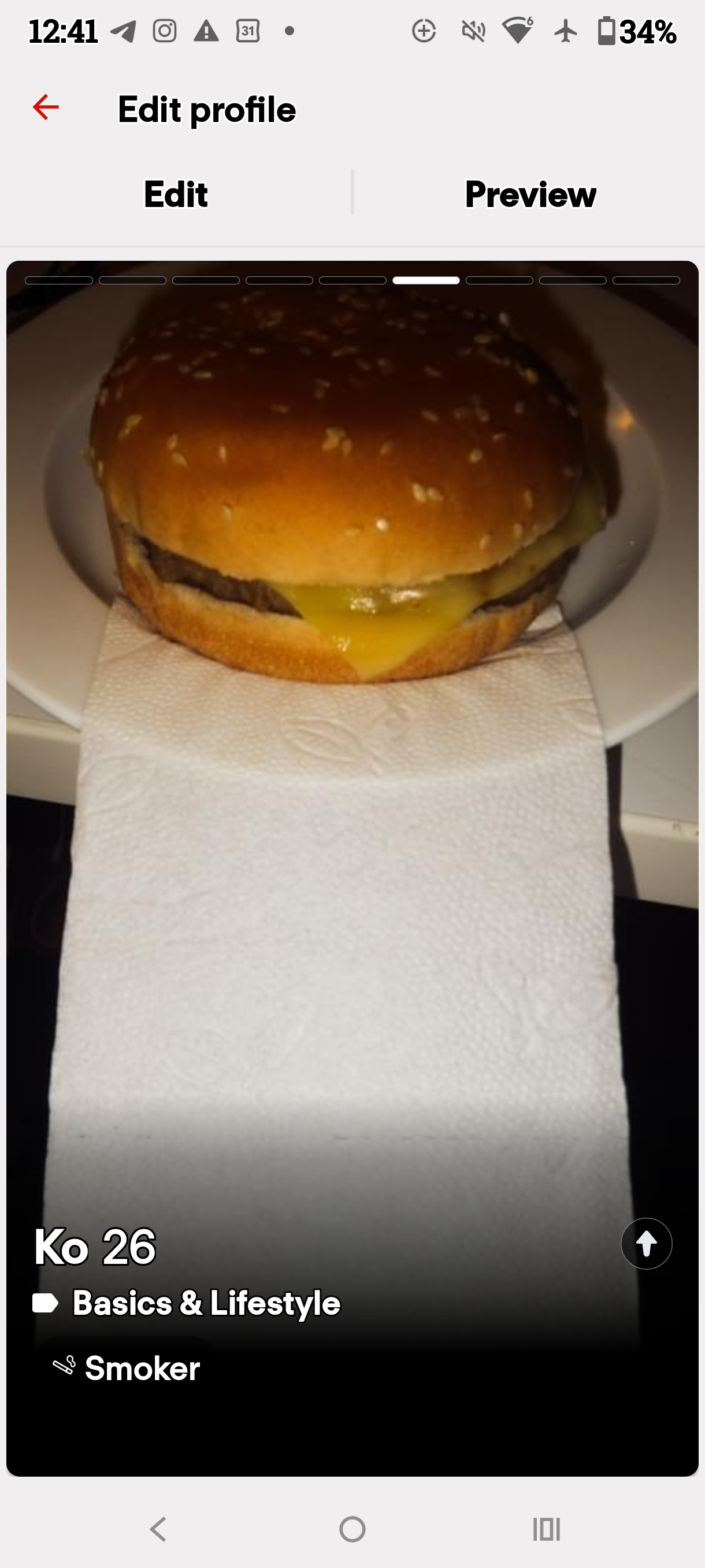 Dating profile preview displaying a cheeseburger and long napkin