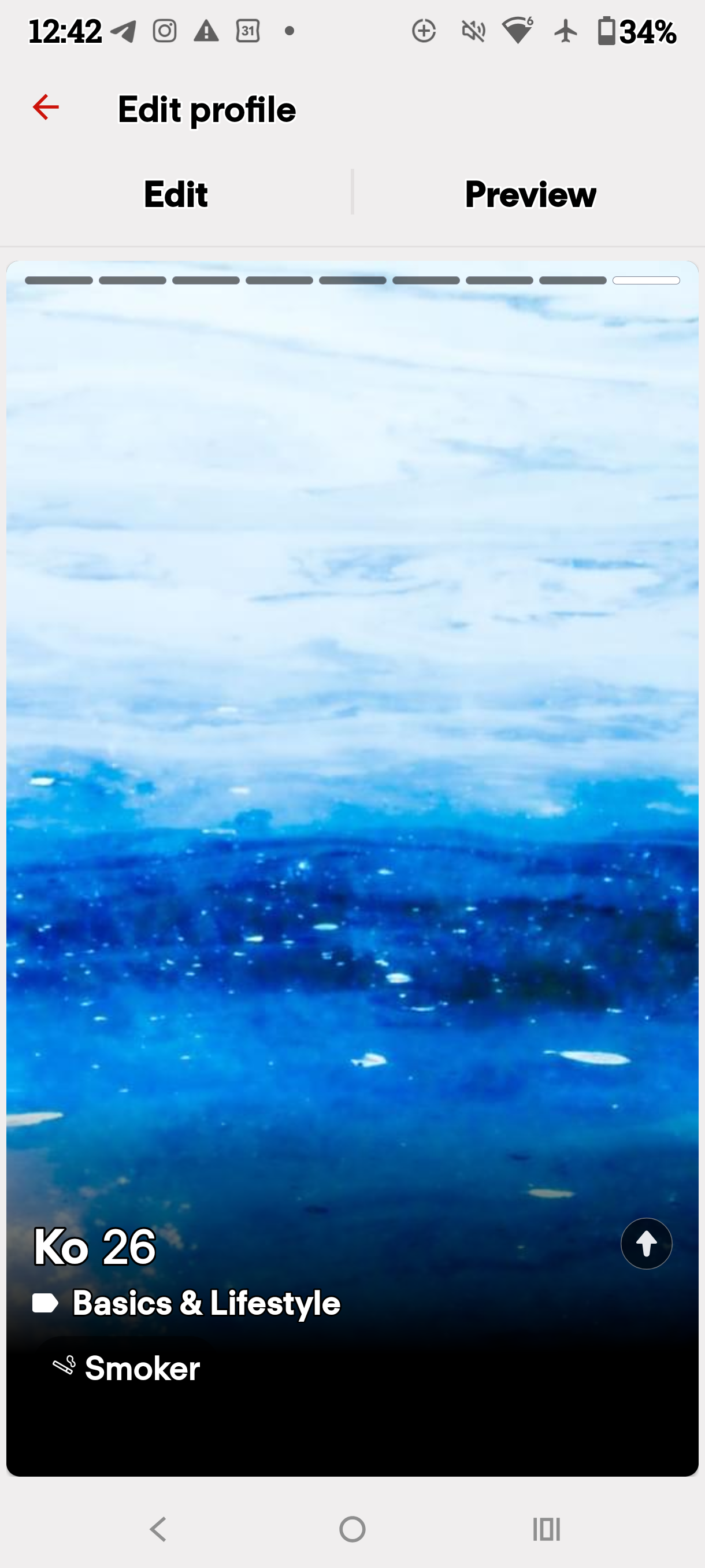 Dating profile preview displaying a blue watery landscape